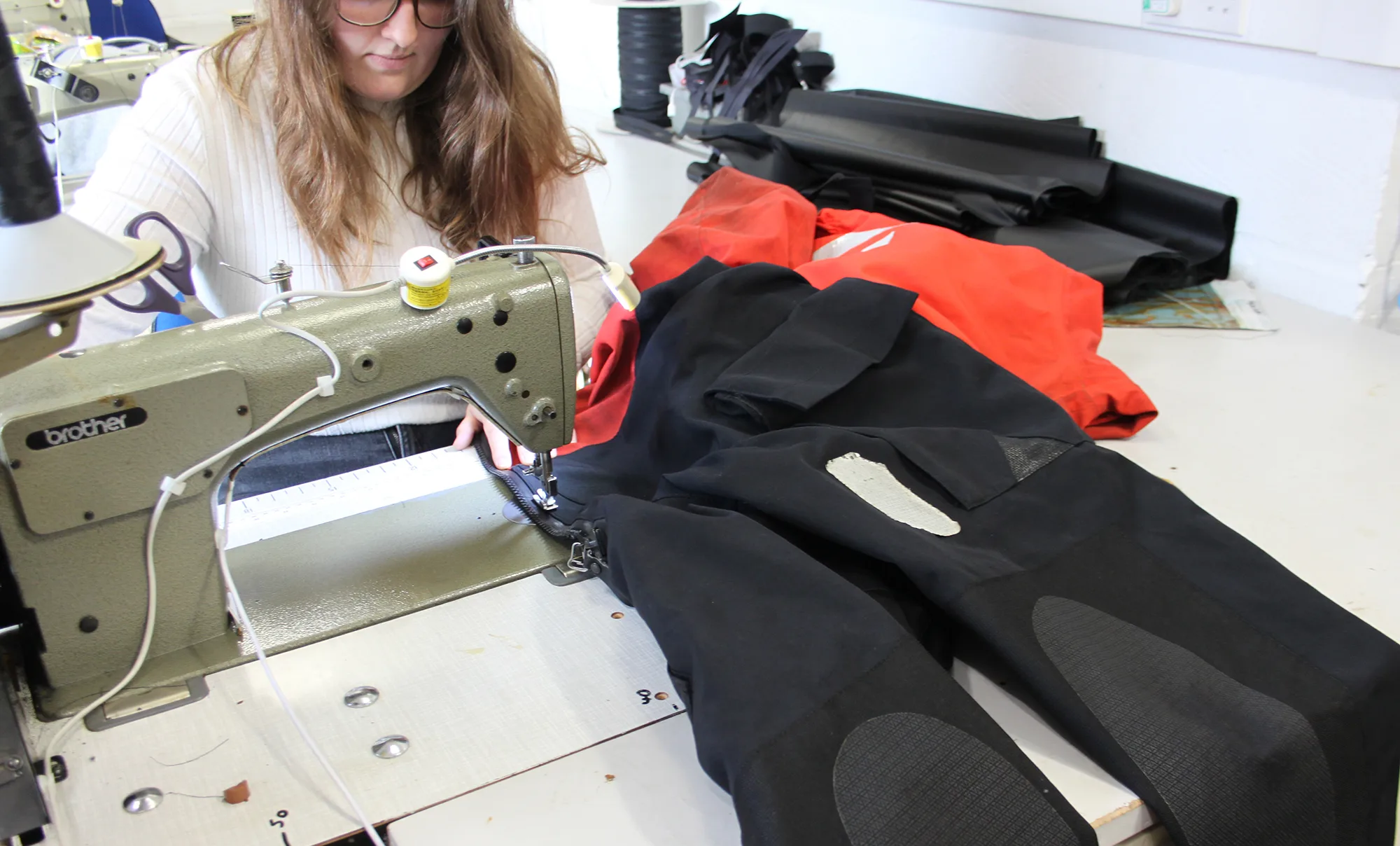 Drysuit being stitched by hand in the Hammond Drysuits workshop in Dartford, Kent